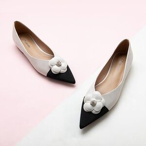 C. Paravano Black and White Flats with Floral Accent
